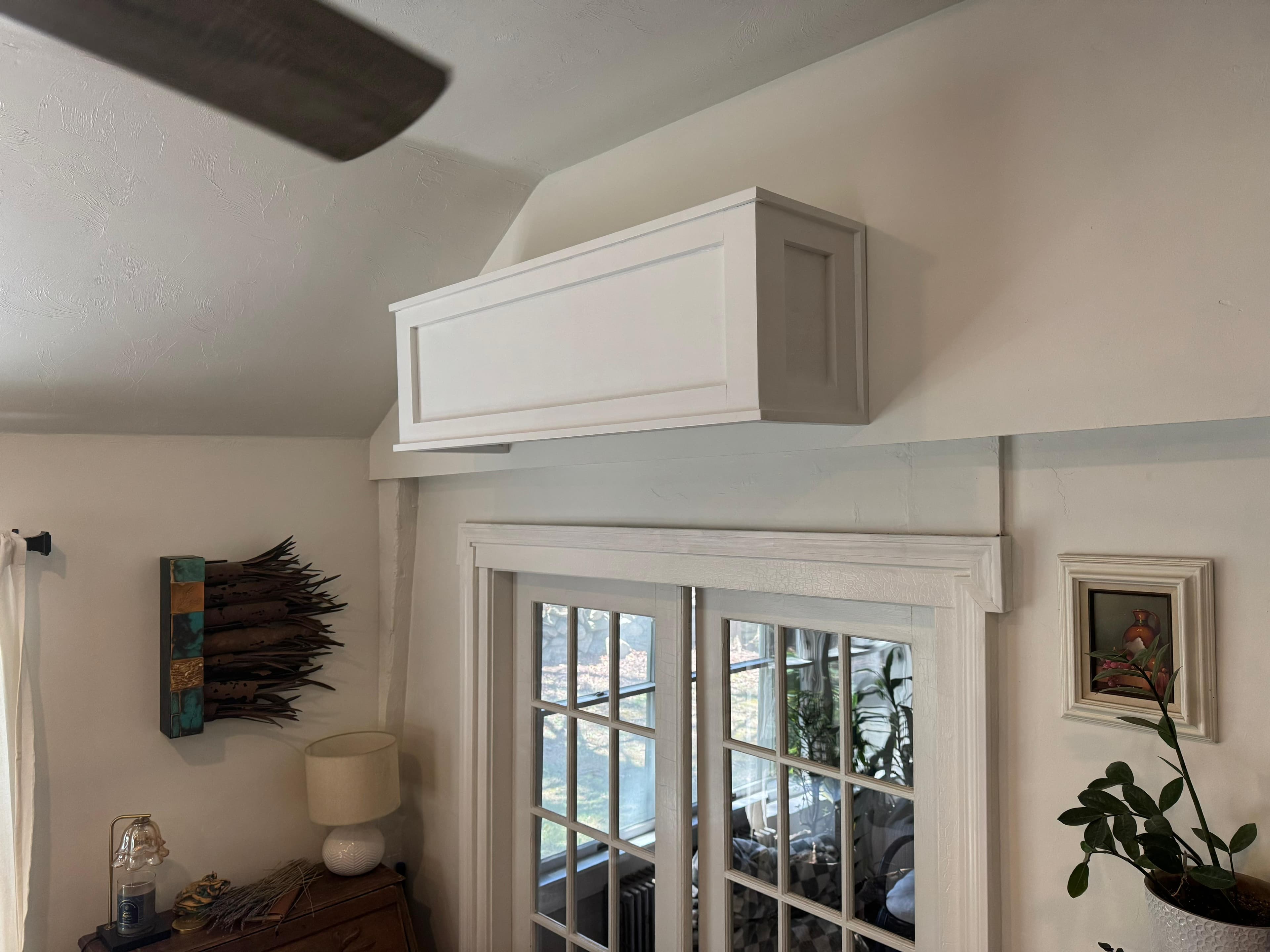 Shaker mini-split cover in a vaulted living room with french doors